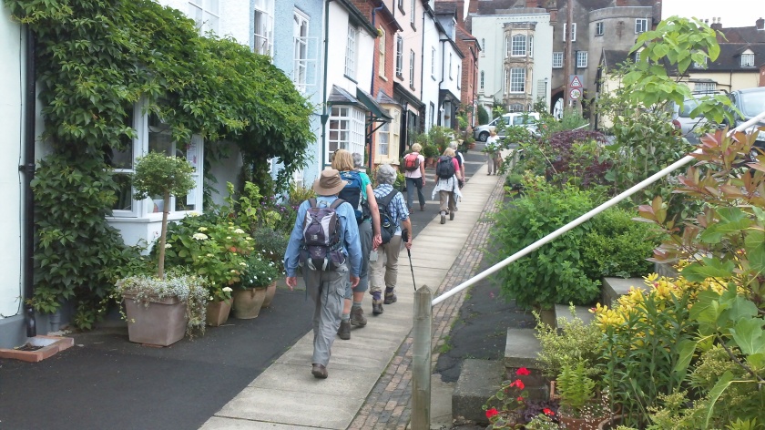 Group walking up Ludlow High Street near end of the walk.